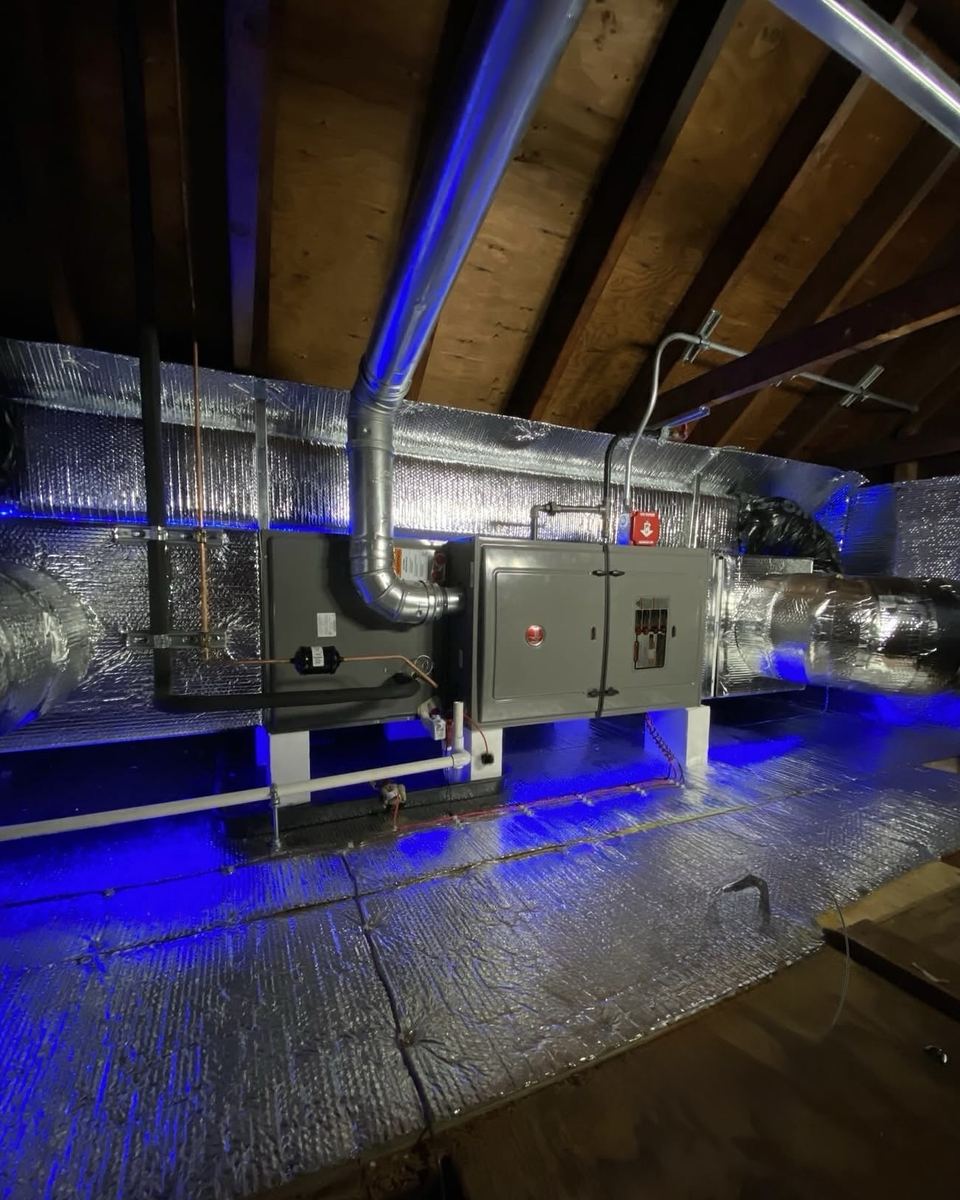 Rheem heating and air conditioning system installed in an attic with sealed insulated ductwork by Jordan Heating and Air Conditioning.